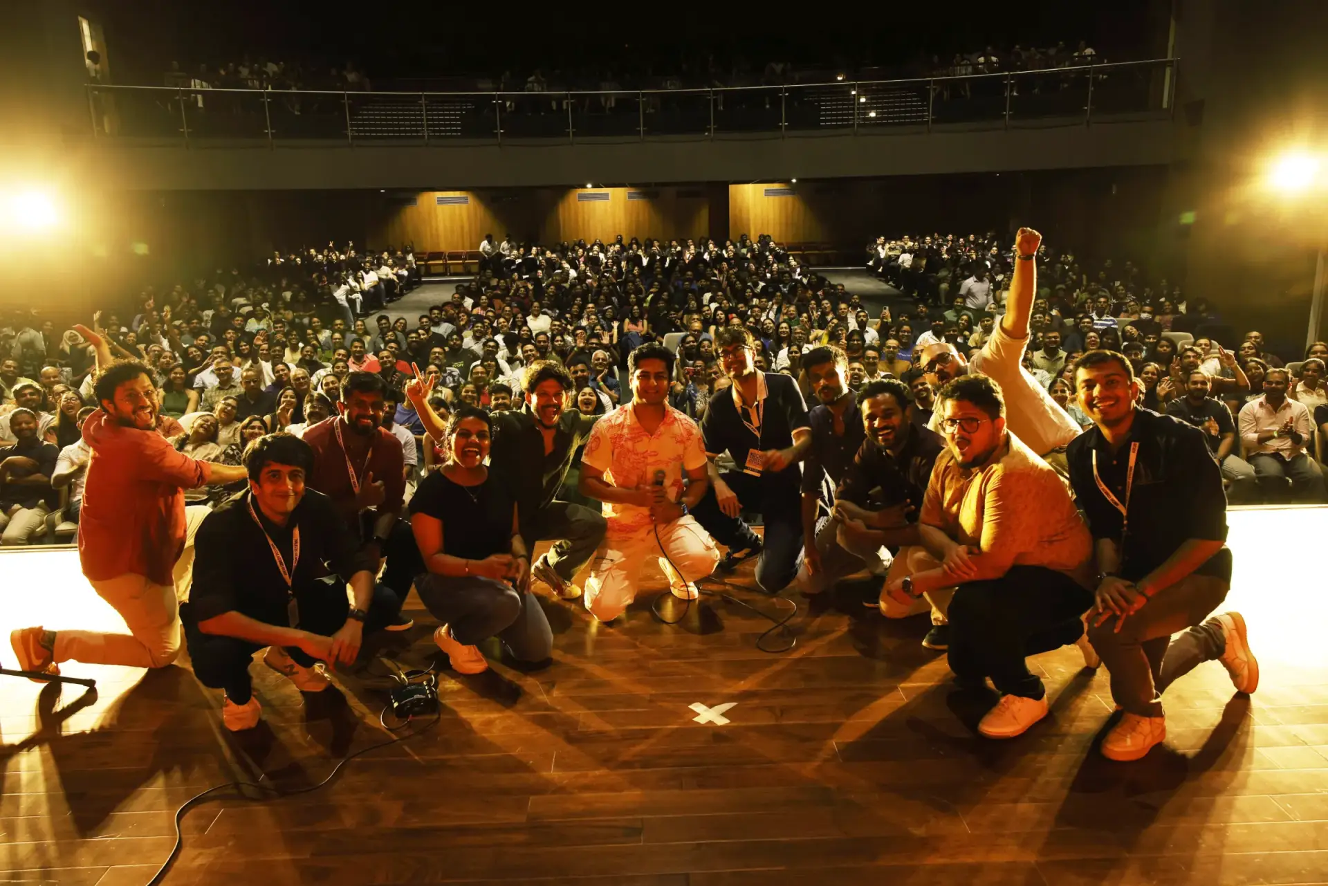 Comedians and audience celebrating on stage at Kochi Comedy Festival in Kerala Kochi Comedy Festival audience and comedians at a live stand-up comedy event organized by Comedy Lounge.