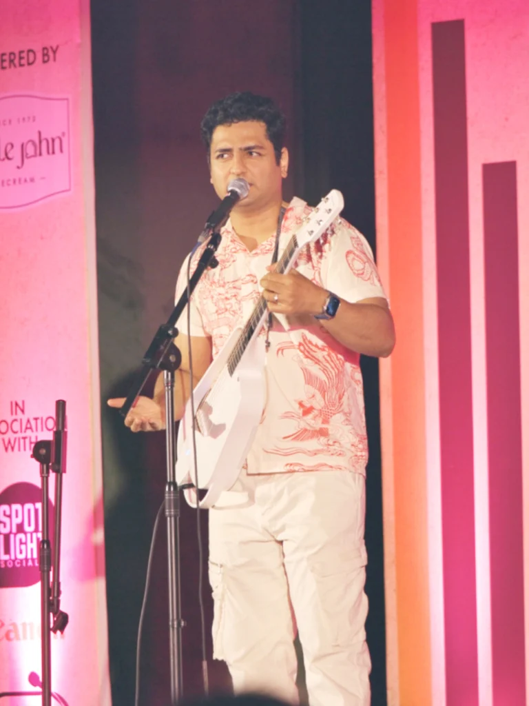 Kenny Sebastian singing and playing the guitar at the Kochi Comedy Festival