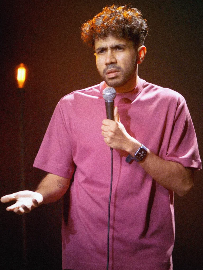 Abhishek Upmanyu performing stand-up comedy during a recorded live show