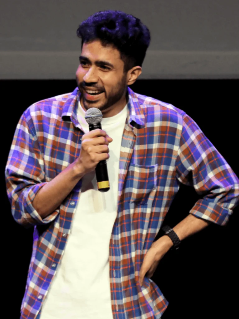 Abhishek Upmanyu performing stand-up comedy during a live comedy show