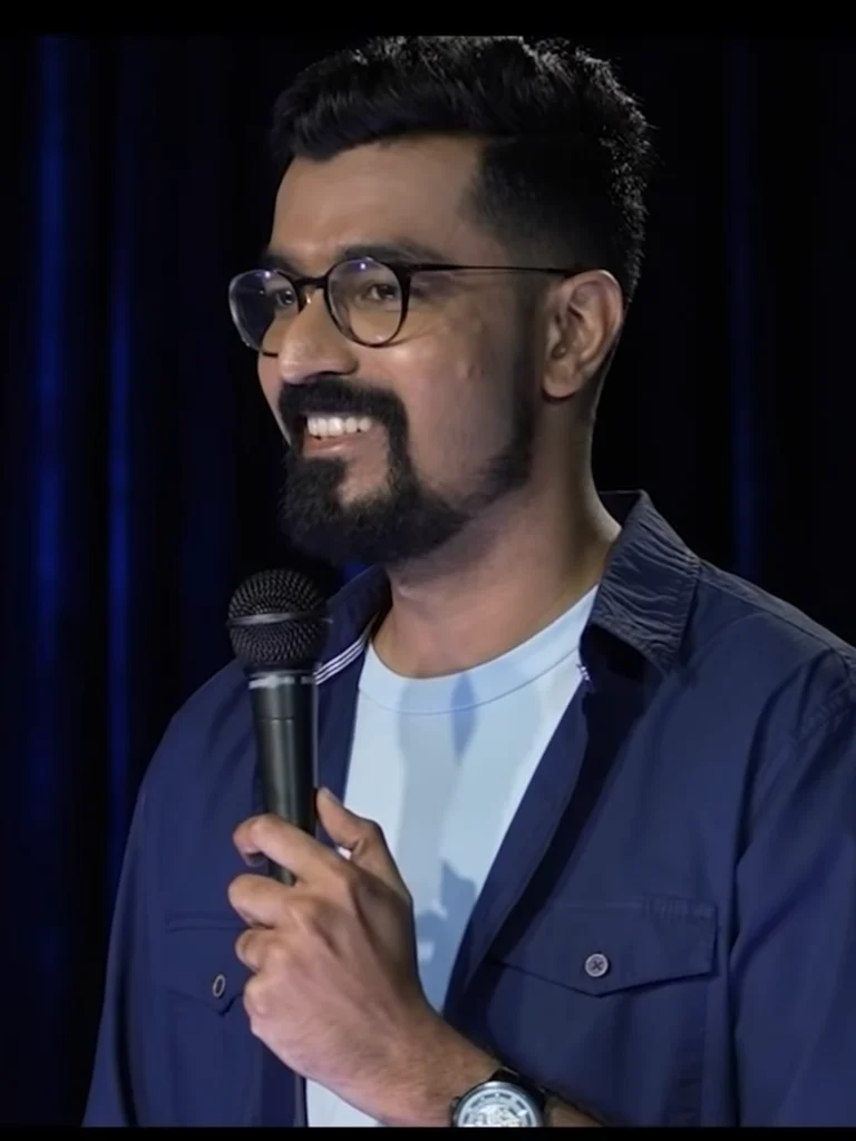 Azeem Banatwalla performing stand-up comedy on stage