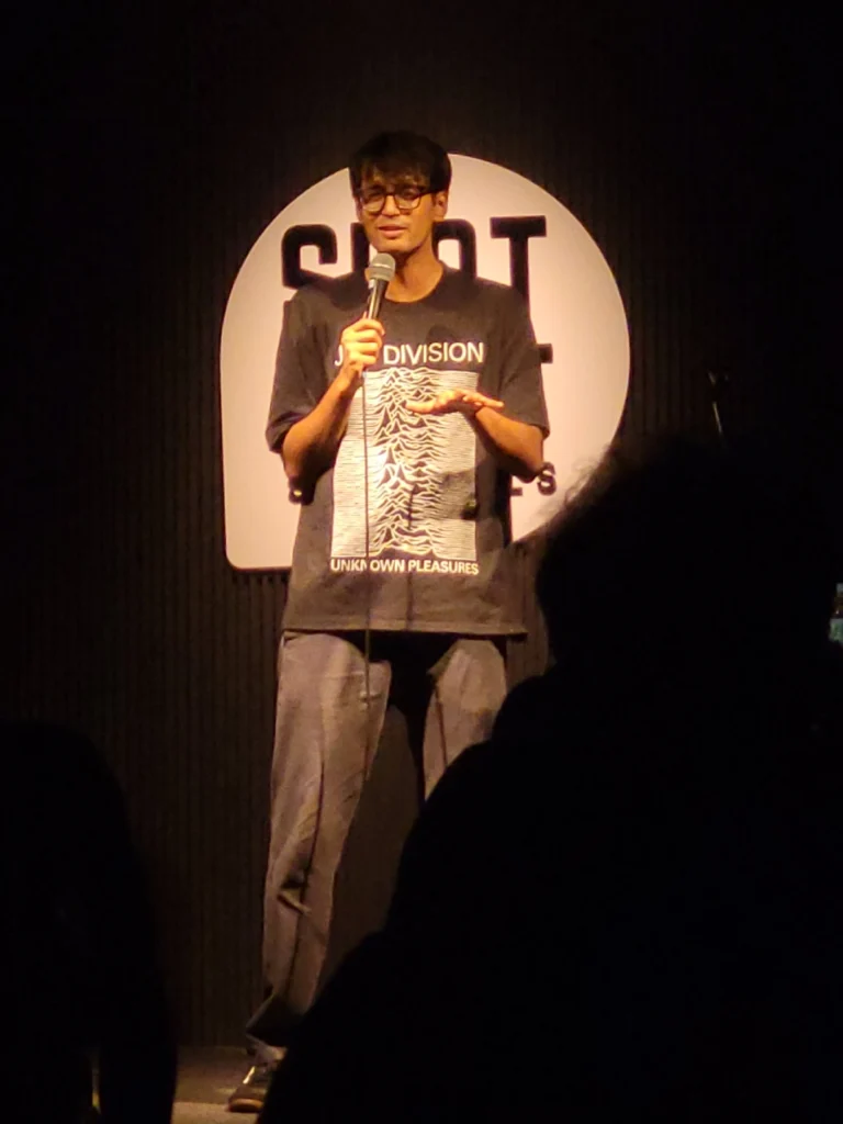 Shamik Chakrabarti performing stand-up comedy at Spotlight Socials MG Road Kochi