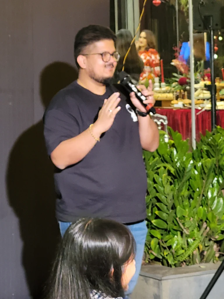 Vishnu Pai performing stand-up comedy at Women's Day event at Croft Kochi