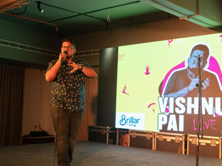 Vishnu Pai performing stand-up comedy at a charity event in Kochi