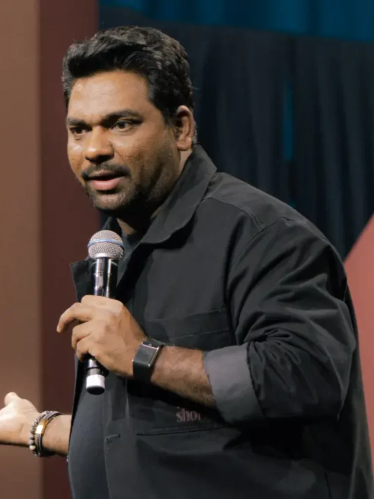 Zakir Khan performing live stand-up comedy show on stage