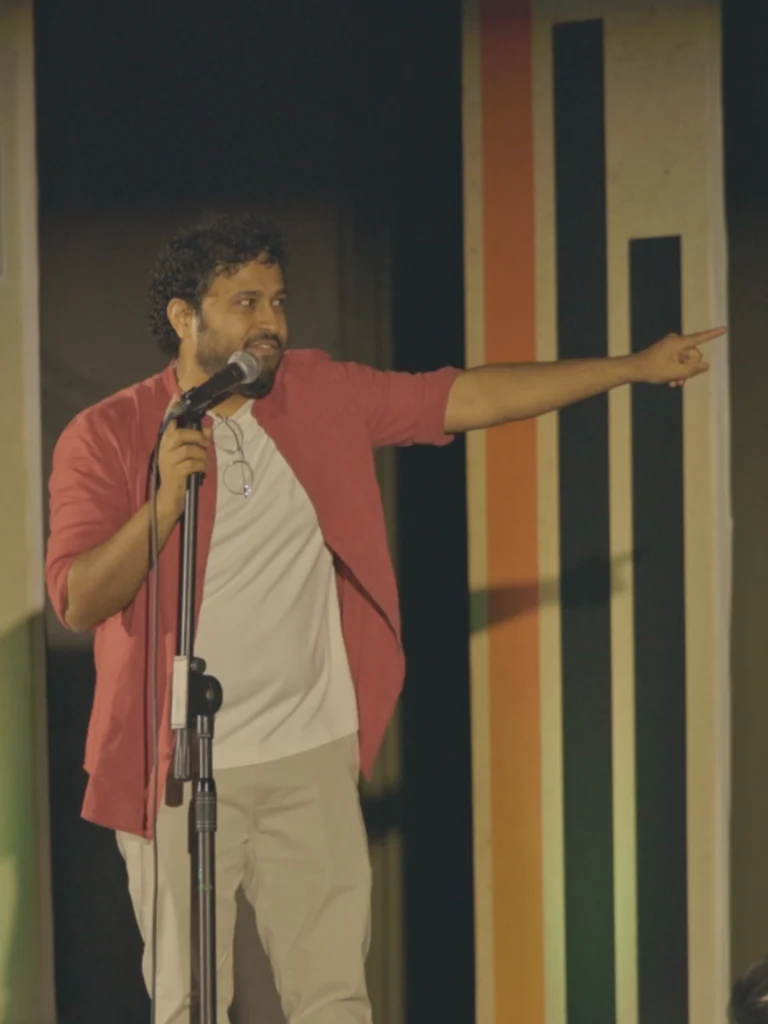Abish Mathew performing live at the Kochi Comedy Festival 2026.