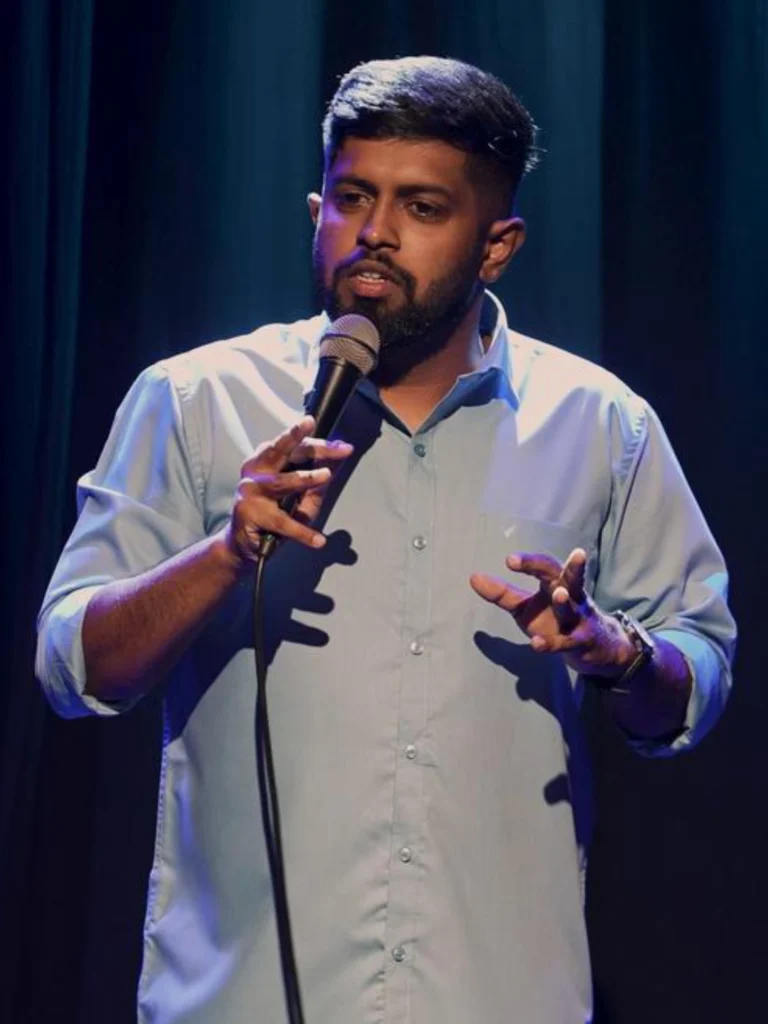 Indian stand-up comedian Anand Rathnam performing a live stand-up comedy show.