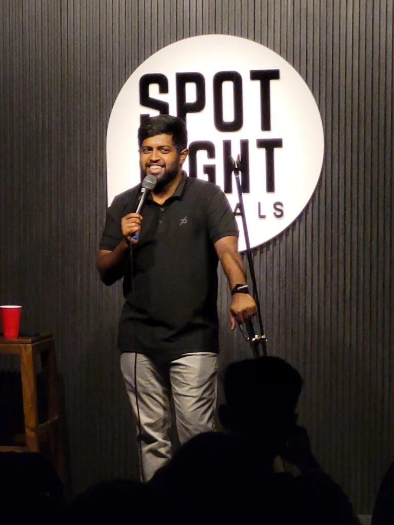 Anand Rathnam performing live at Spotlight Socials during a Comedy Lounge comedy show in Kochi.
