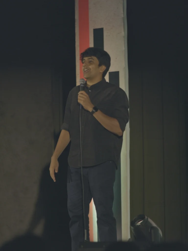 Gautham Govindan performing live at the Kochi Comedy Festival 2026.