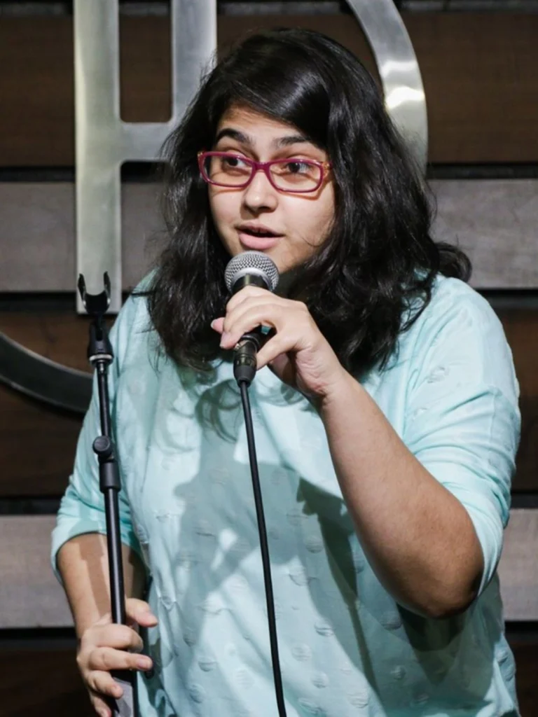 Shreeja Chaturvedi performing stand-up comedy on stage.