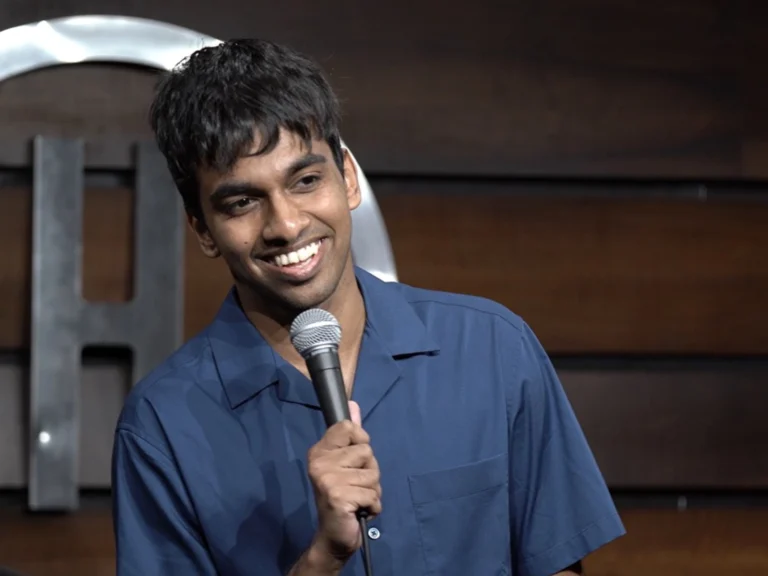 Indian stand-up comedian Tarang Hardikar performing live with a microphone.