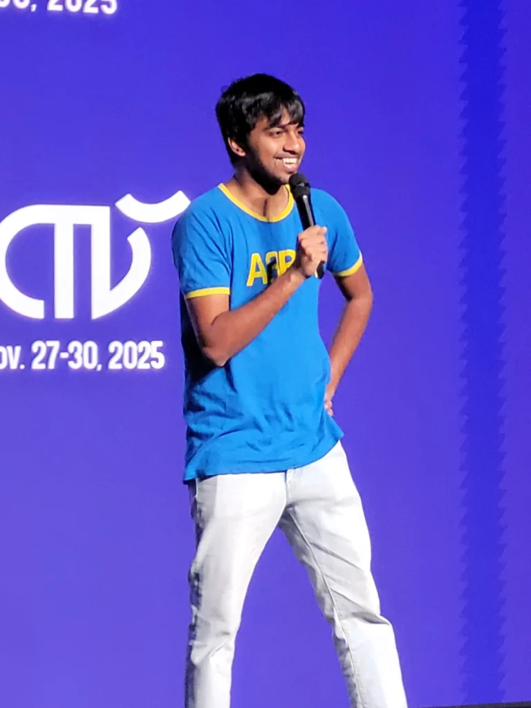 Tarang Hardikar performing stand-up comedy at Manorama Hortus 2025, curated by Comedy Lounge.